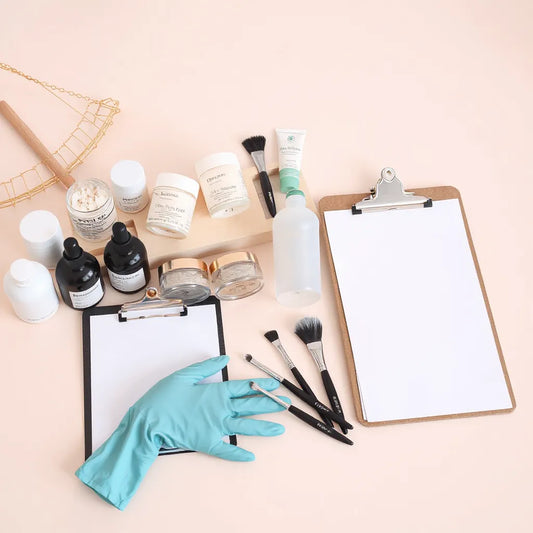 Neatly arranged professional beauty products and tools on a clean countertop with gloves