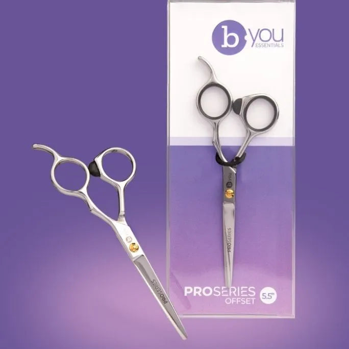 B You Professionals ProSeries Clipset 65 scissors shown both loose and in their retail packaging against a solid purple background.